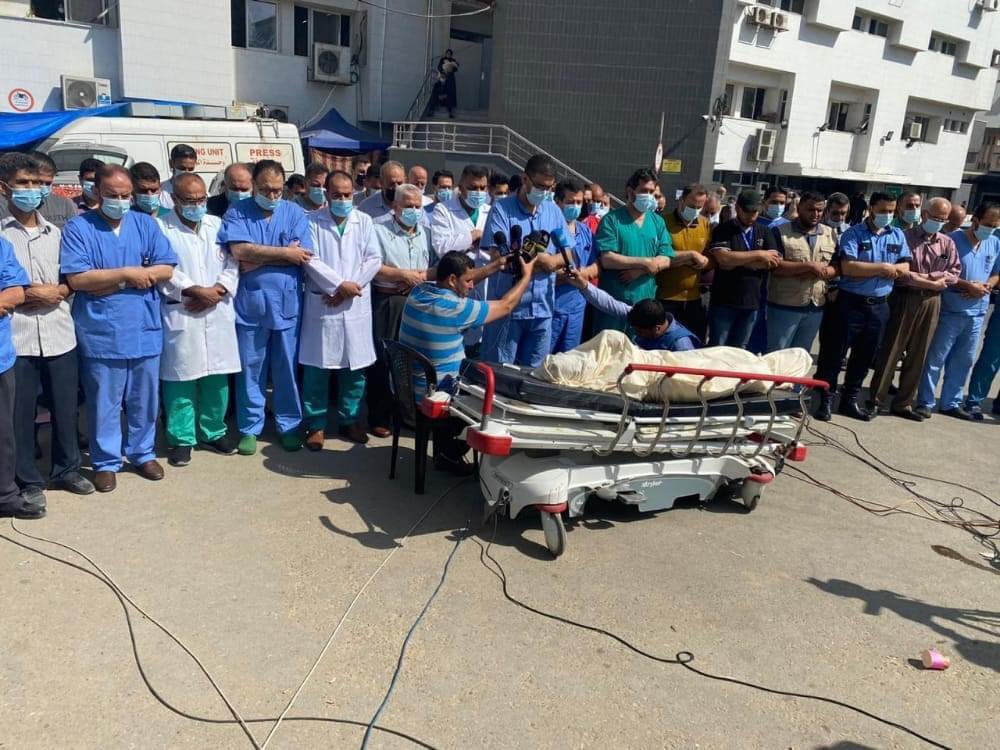 At Shifa hospital in Gaza, medical staff pray for their murdered colleague, Dr Ayman Abu Elouf, head of internal medicine, who was killed at dawn by an Israeli air strike.

His wife and five sons are still missing under the rubble of their home.

#GazaUnderAttack #Gaza #warcrimes