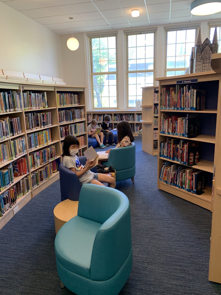 r_witmer's tweet photo. Milk and Cookies nestles into the library for some reading time #greenacrespride https://t.co/ByMpR7axi3