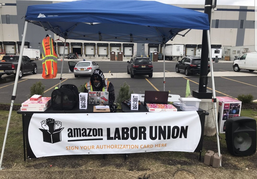 DickJackman1's tweet photo. @amazonlabor I'm no land surveyor/labor lawyer, but maybe next time don't set up on the property? Based on the fence, which I assume would be on the property line this would be on property, not public land. https://t.co/LczL2CV0cs