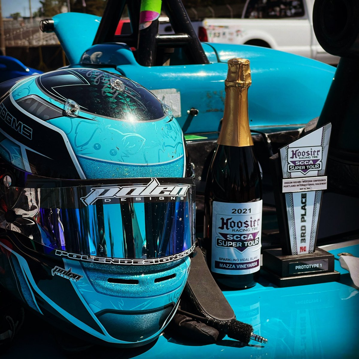 Podiums are great and all, but matching your car with your safety gear? Priceless.