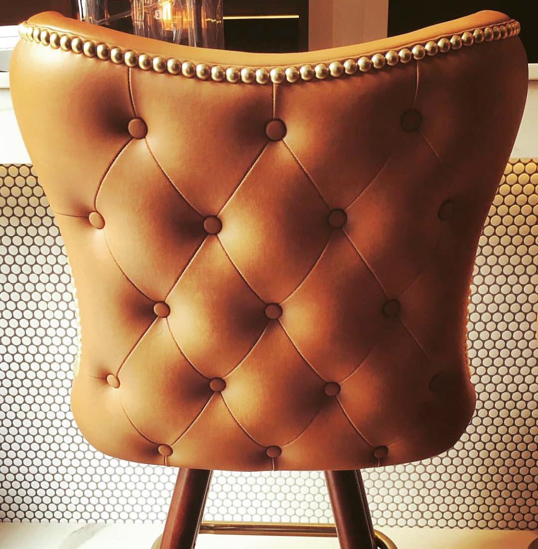 blocHaus's tweet photo. We LOVE a good tufting detail on a chair, barstool, or sofa! These "Button Tufted Cowboy Bar Stools" by @logobarstools that we pulled for Dixie are stunning, and fit the concept of the space perfectly. Sometimes it's the small details that make a design complete! https://t.co/Ck8Yx1ODiG