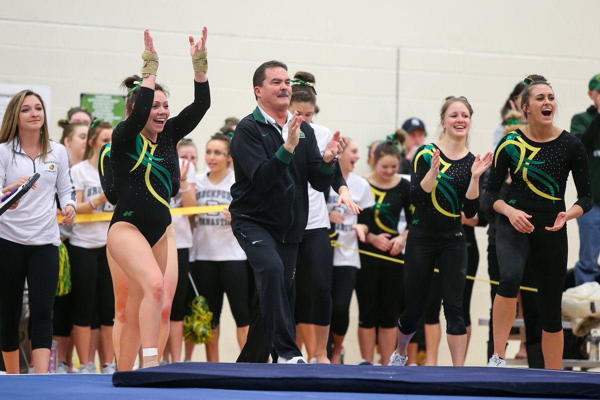 BportAthletics's tweet photo. Brockport's "𝔽𝕒𝕥𝕙𝕖𝕣" of Gymnastics Head Coach John Feeney to Retire After 22 Years. 

2⃣x National Champion 🏆🏆
9⃣x Regional Champion ✅
3⃣x National Coach of the Year ✅
1⃣3⃣0⃣ All-Americans ‼️

📰: https://t.co/msvVIpUTF1

#Legend | @d3ncga | 🦅🤸‍♀️ https://t.co/aumCtWERZR