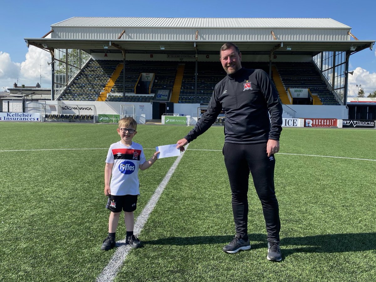 DundalkFC's tweet photo. Darren Meehan and his son Shane were at Oriel Park last week to collect a cheque of β¬630 from Dundalk FC community officer Liam Burns in aid of the #SmileForShane campaign. The donation was made by the staff and players at Oriel Park back in March. #ClubTownCommunity https://t.co/1I2Bvpv7Sd