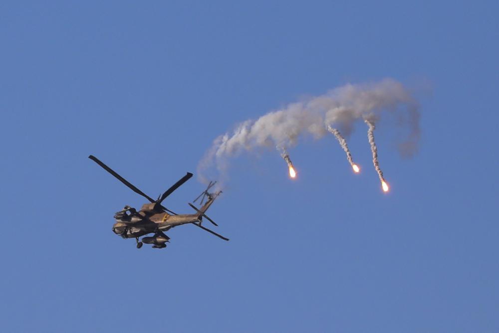tntjho's tweet photo. An Israeli attack helicopter launches flares as he flies over the Israeli Gaza border, southern Israel, Thursday, May 13, 2021

#SaveGazaFromZionists https://t.co/uvAx2CUx8G