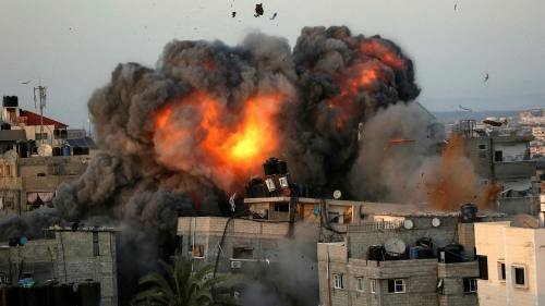 tntjho's tweet photo. An Israeli air strike on a building in the Rimal residential district of Gaza City on Sunday, 16th May. 

#SaveGazaFromZionists https://t.co/vNby0LT2tA