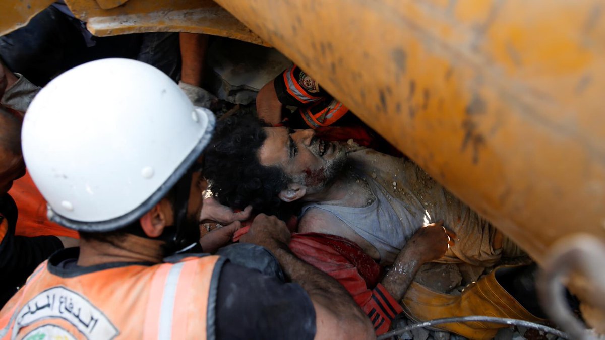 ameenyousef08's tweet photo. Palestinian rescue workers pulled dead bodies from the rubble of buildings destroyed by Israeli airstrikes in Gaza City. The air raids killed at least 42 people, including 10 children. Israeli Prime Minister says the raids will continue in "full force"
 #IsraelStopPlayingVictim https://t.co/6kT7V2Oj6m