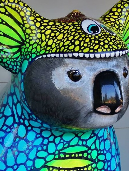hellokoalas's tweet photo. As a very cute dinosaur, Koalasaurus Max knows every species is vulnerable. So for National Road Safety Week Max is leading the #hellokoalas message to Slow Down to Save All Lives - human and animal. We have 11 yellow-ribboned Hello Koalas at @Sails_resort. #roadsafety #DriveSOS https://t.co/XqAhnBv5Bj