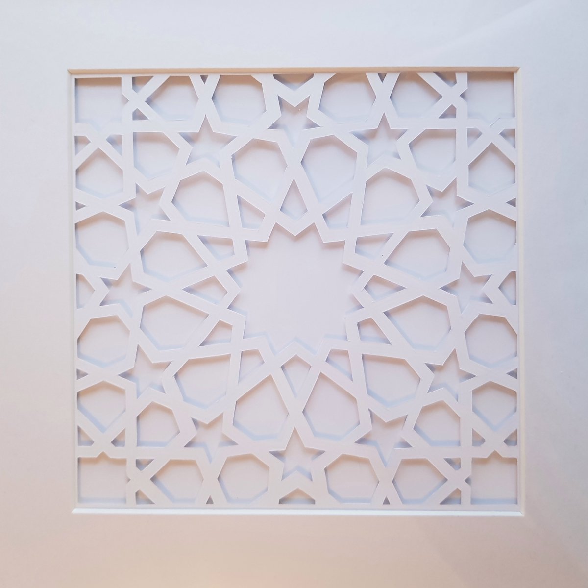 MandalaMeadow's tweet photo. My first attempt at paper cutting Arabic geometry and I love it! I originally intended to use a coloured background but then I saw the effect of white and white and fell in love with the simplicity #geometricart #ArabicGeometry #papercraft https://t.co/UyuBi8DOBT