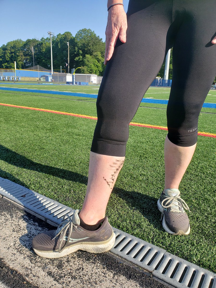 I asked some <a href="/fcpsfairfaxhs/">@FCPSFairfaxHS</a> alum girls walking the track today to take these photos after my 1mi run, bc I ran it in bike gear post-7mi-bike-ride for my triathlon training. I HAD to get the bike grease on my leg in the photo. strava.app.link/9HgB5bimmgb