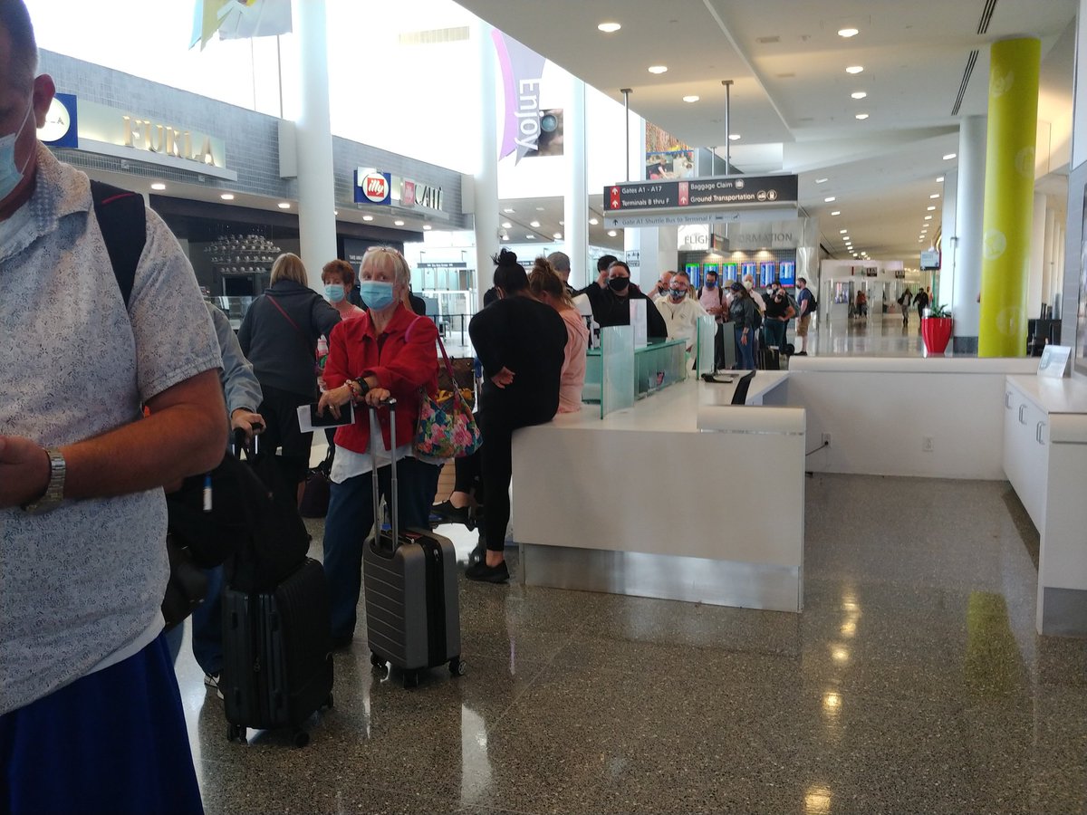 SignificantSort's tweet image. Flight from Phoenix delayed. Missed my connecting flight. This is the line to rebook. Only one person working the American airlines counter.