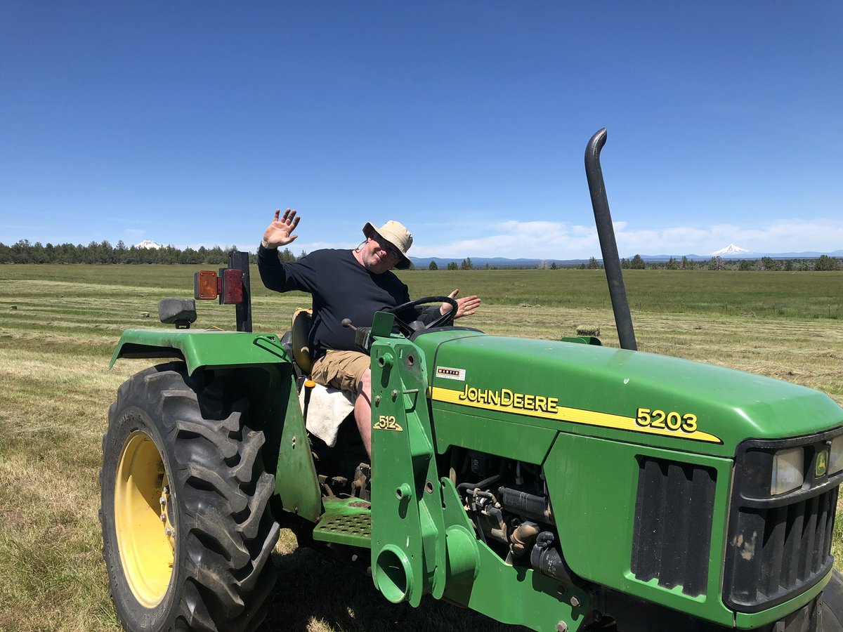Dad was a Massey Ferguson guy but I always tried to get him to the green side. We cut are own hay to feed our animals during the winter, every year his old TE20 broke and we had to go green😂 I made him take this picture to prove I was right.