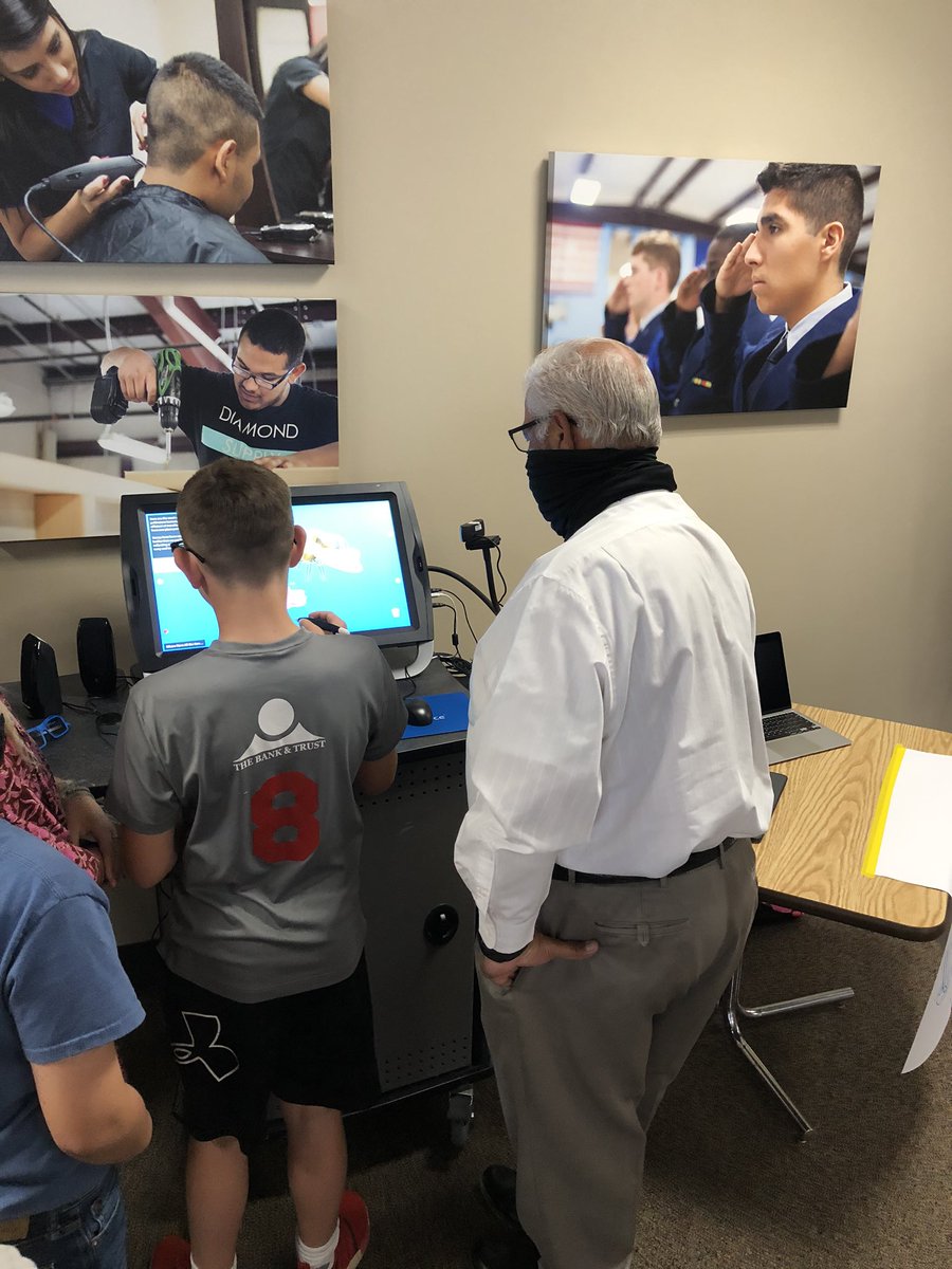 Gerald Gallegos watching closely as the student is able to lift image off the screen during Stem Showcase.#SAISDStem21