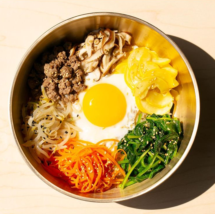 Bibimbap is a traditional Korean Rice bowl with healthy vegetables and bulgogi 🍲
This is the nutritionally perfect food. It serves with a fried egg and gochujang in the traditional bowl. 
#brooklyn #korean #restaurant #clean #parkslope #takeout #asian #taste #비빔밥