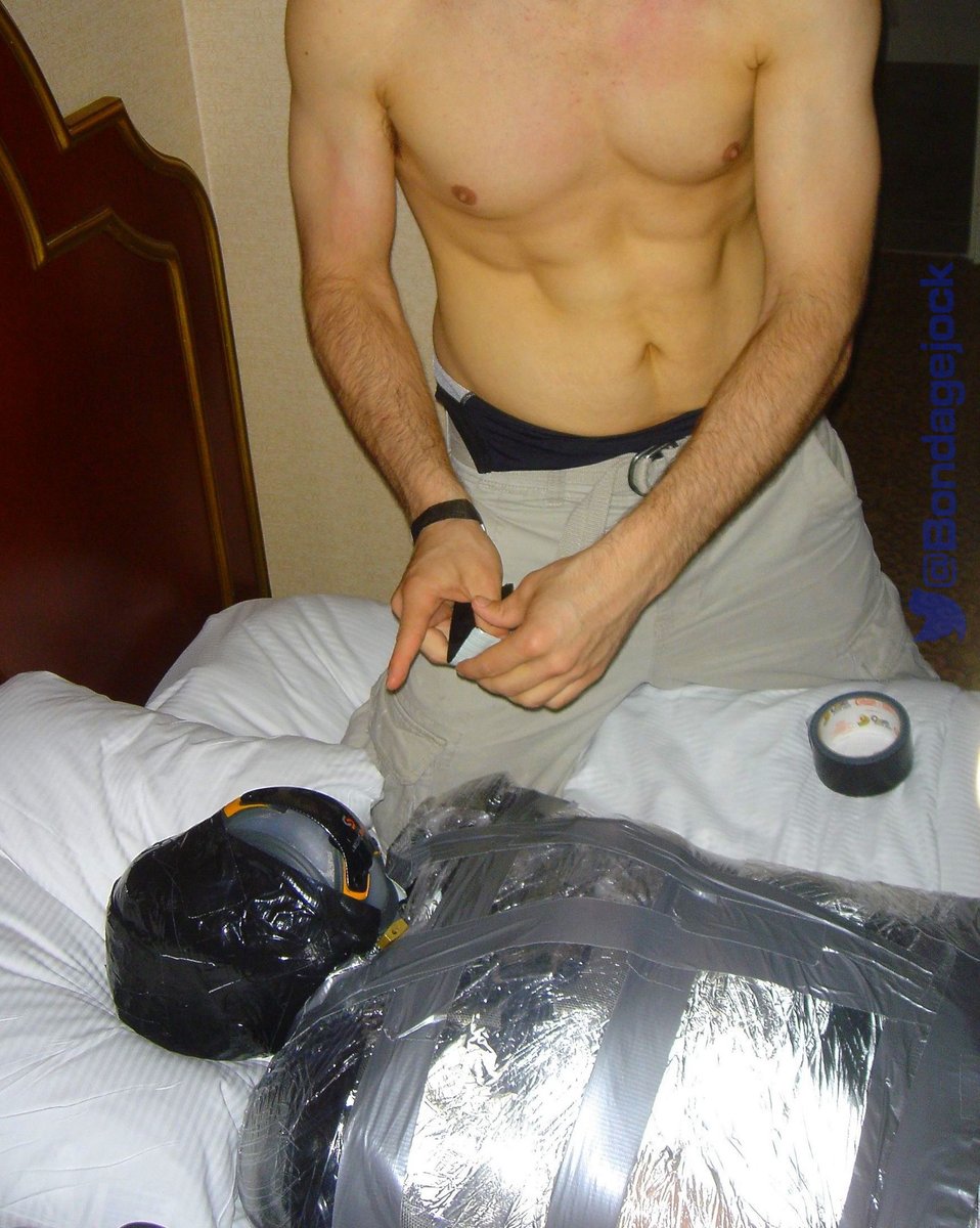 bondagejock's tweet photo. Throwback Tuesday pic. Wrapped a guy up in football gear and taping my game worn hockey cup to his face. (Dom: @bondagejock) https://t.co/LHtsnQHgLS