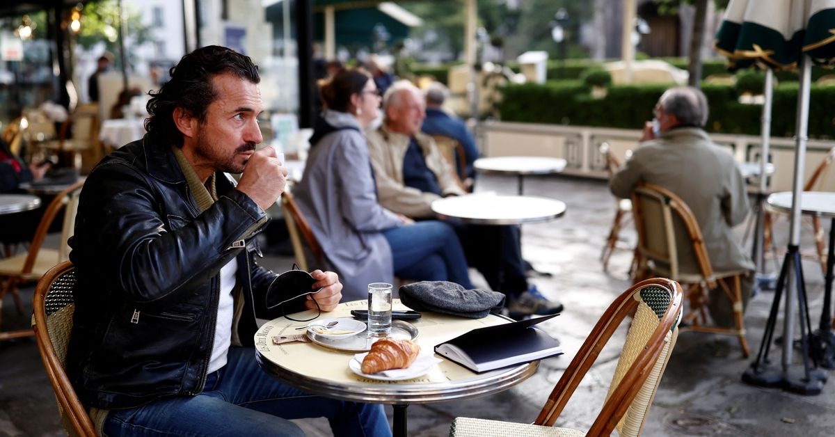 Reuters's tweet photo. Parisians tuck into coffee and croissants again as cafes re-open https://t.co/CyZVAjIr95 https://t.co/ecgJ2OPyy0
