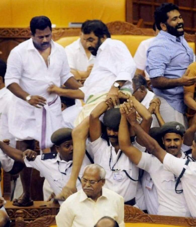 Meet Sivan Kutty, the man who is seen jumping over security &amp; destroying Speaker's podium inside Kerala assembly is new Education Minister of Kerala.