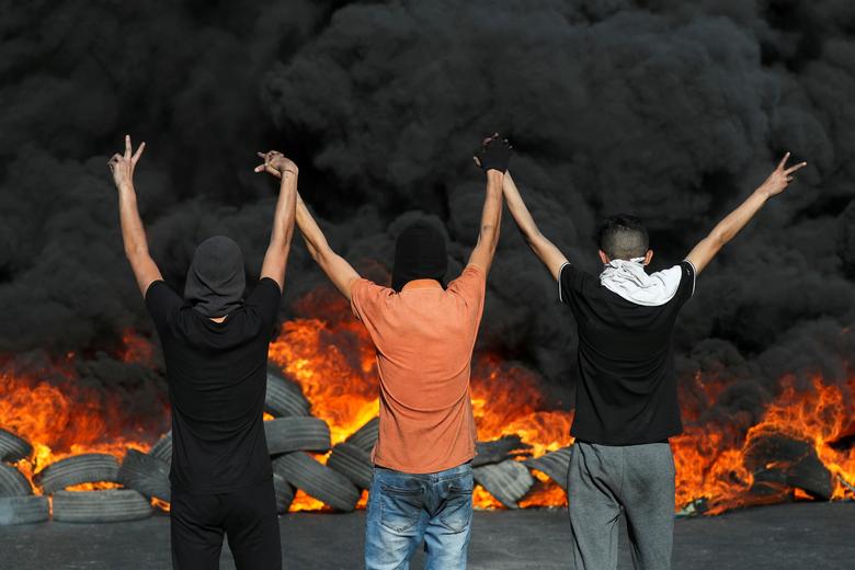 humanventure's tweet photo. Reminder! Friday Community Call, 12:00MT. Catch up with alum &amp; current events. Details: https://t.co/sof0LDFwb4 Image: Palestinian demonstrators look at burning tires during a protest in the Israeli-occupied West Bank, May 16. REUTERS/Ammar Awad https://t.co/2ESlZJhmOO