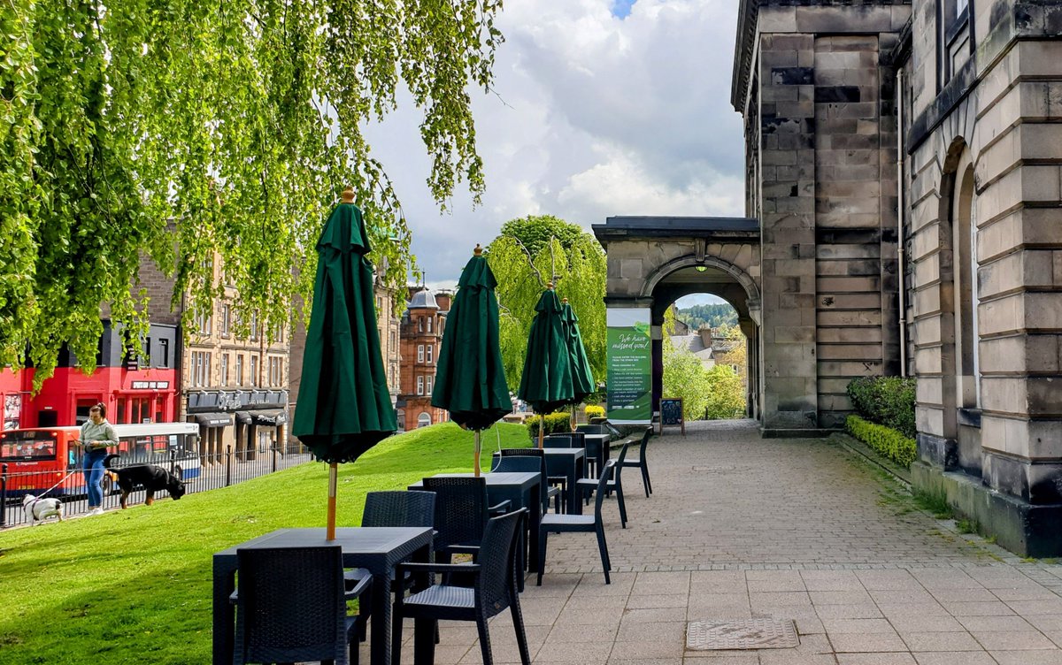 Trees, greenery &amp; no traffic makes tables outdoors much more attractive.