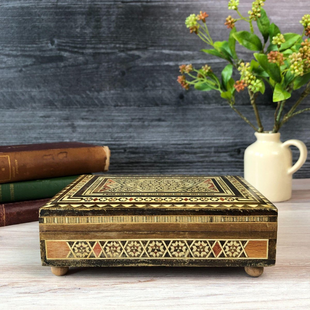 Vintage Marquetry Wood Music Box, Small Footed Wooden Storage Box, Inlaid Wood Jewelry Box #vintageseller #vintagefashion
➤ etsy.me/3uW6GCy