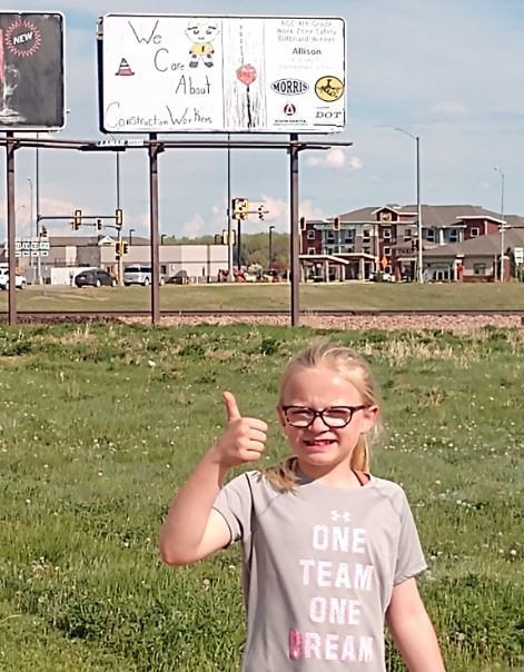 SouthDakotaDOT's tweet photo. AGC &amp; SDDOT recently announced the winners for the annual work zone awareness billboard campaign. 
https://t.co/Q58QqulFiv

Allison of Pierre is pictured by her billboard, "We Care about Construction Workers!"

Congrats to the 2021 winners!  We appreciate the work zone awareness! https://t.co/RIaJqM5ALc