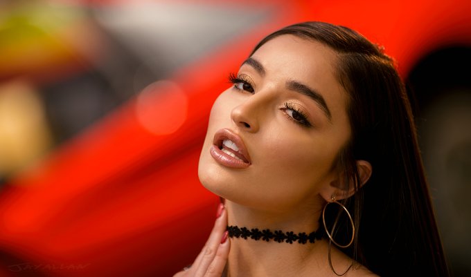 Gorgeous portrait of stunning @emilywillisxoxo as she leans up against the red sports car in this portrait