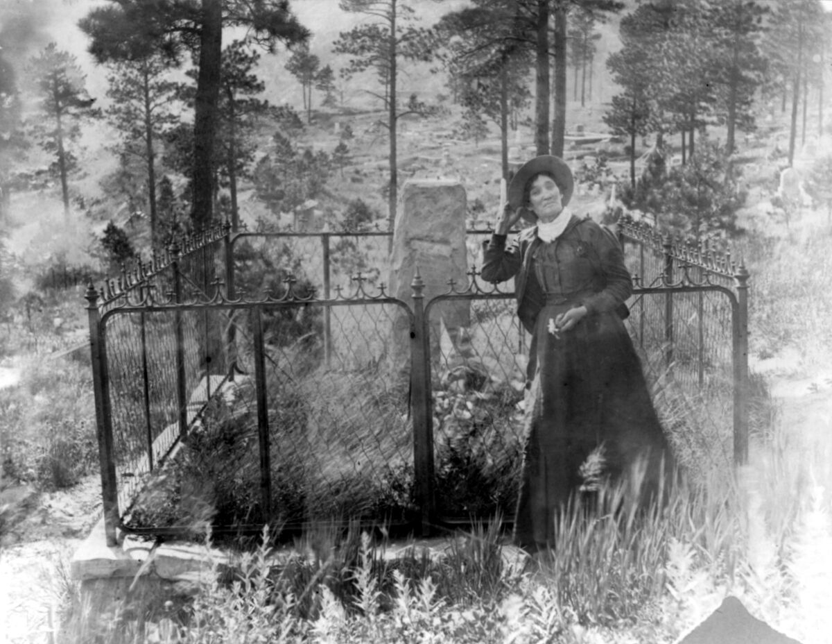 Mary Dee (Author) on X: "A historic photo of Martha Jane Cannary, better  known as Calamity Jane, mugging at the grave of James Butler “Wild Bill”  Hickok in Mt. Moriah Cemetery, Deadwood,