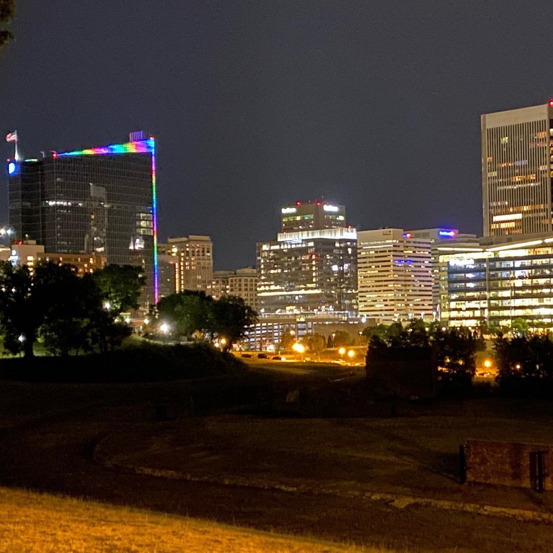 The #rva skyline is showing its pride. 🏳️‍🌈 Take a look at the @dominionenergy building lit up for the month or June. #pridemonth 📸: by Regina Boone of the @richmondfreepressusa .