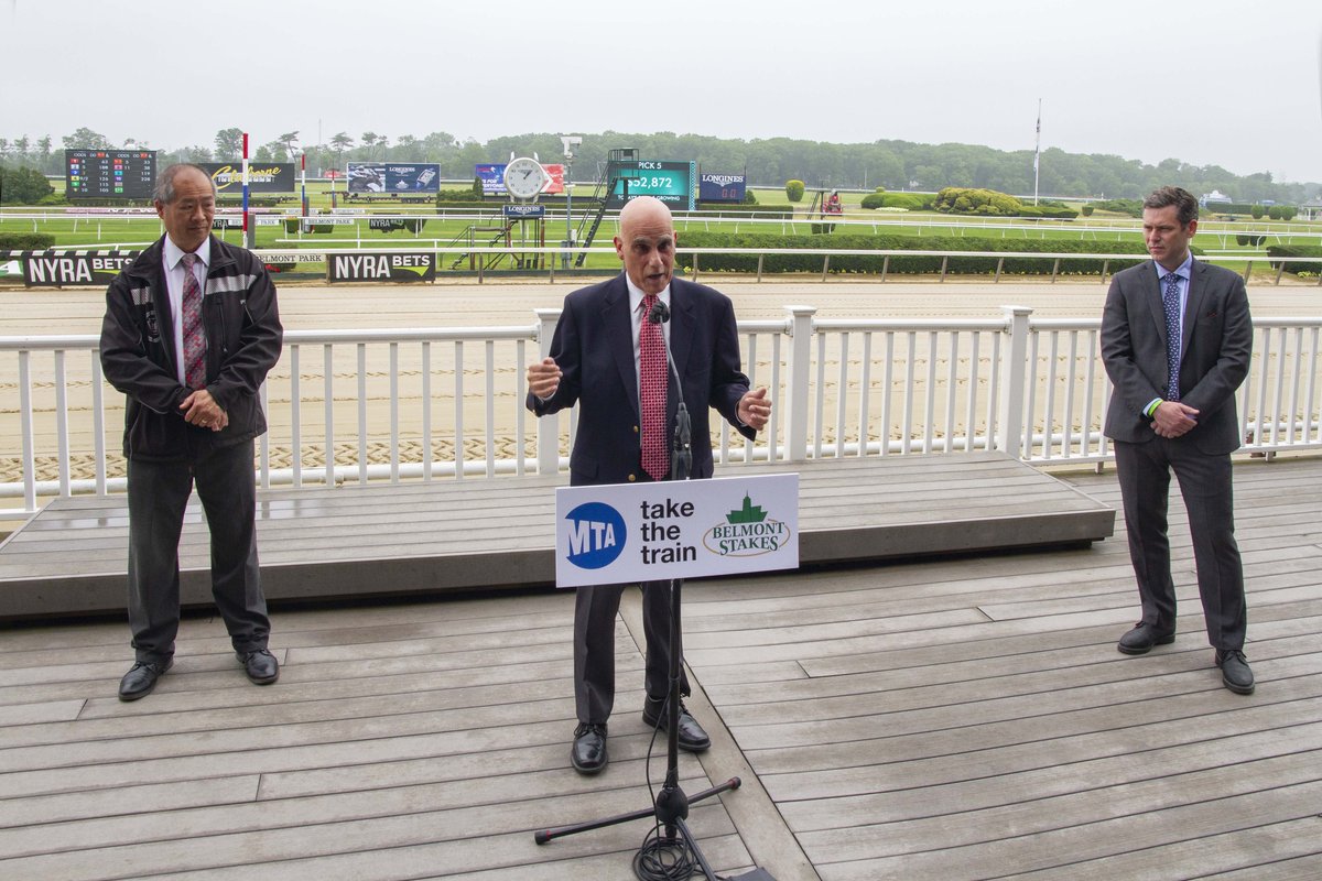 speaking from the podium at belmont park.
