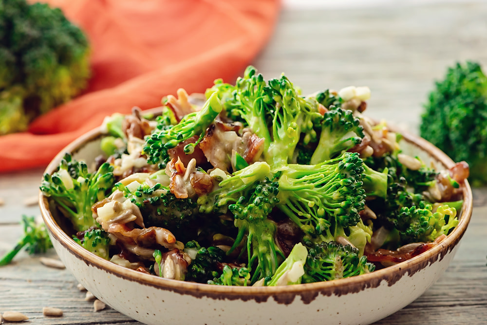 Broccoli Bacon Salad is an easy side dish made with raw broccoli, bacon, raisins, sunflower seeds and a mayonnaise vinegar dressing. This traditional recipe is versatile enough for summer cookouts or a holiday dinner table! bit.ly/2Xh9zfH