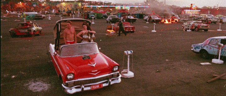 RavenLunachick's tweet image. The inmates, many of whom sport punk fashion, are placated with a steady diet of junk food, new wave music, drugs, and exploitation films. #DeadEndDriveIn 🤘😜🤘
Sounds like the perfect date night! 
*Available on @Tubi! 📺
#Screenshots #80sMovies 🎬 
 #PunkRock #TerrorTuesday 😱