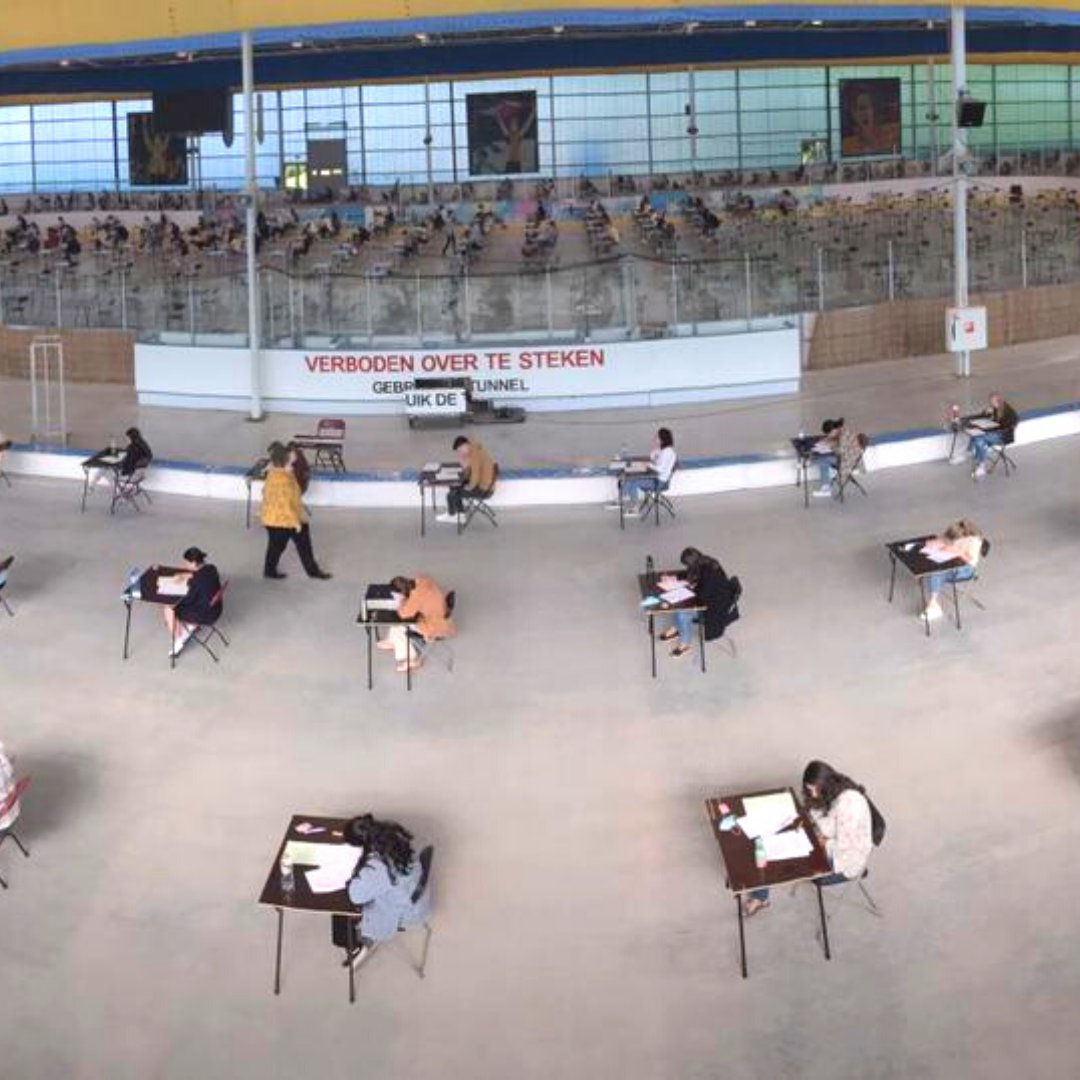 TilburgU's tweet photo. What an extraordinary place to take exams. During this year’s exam period, the exams do not only take place in lecture halls but also on the Ireen Wüst ice skating track. This makes for a unique picture. Since this is a very large space, several exams can be held simultaneously. https://t.co/vCUlV1pr1V