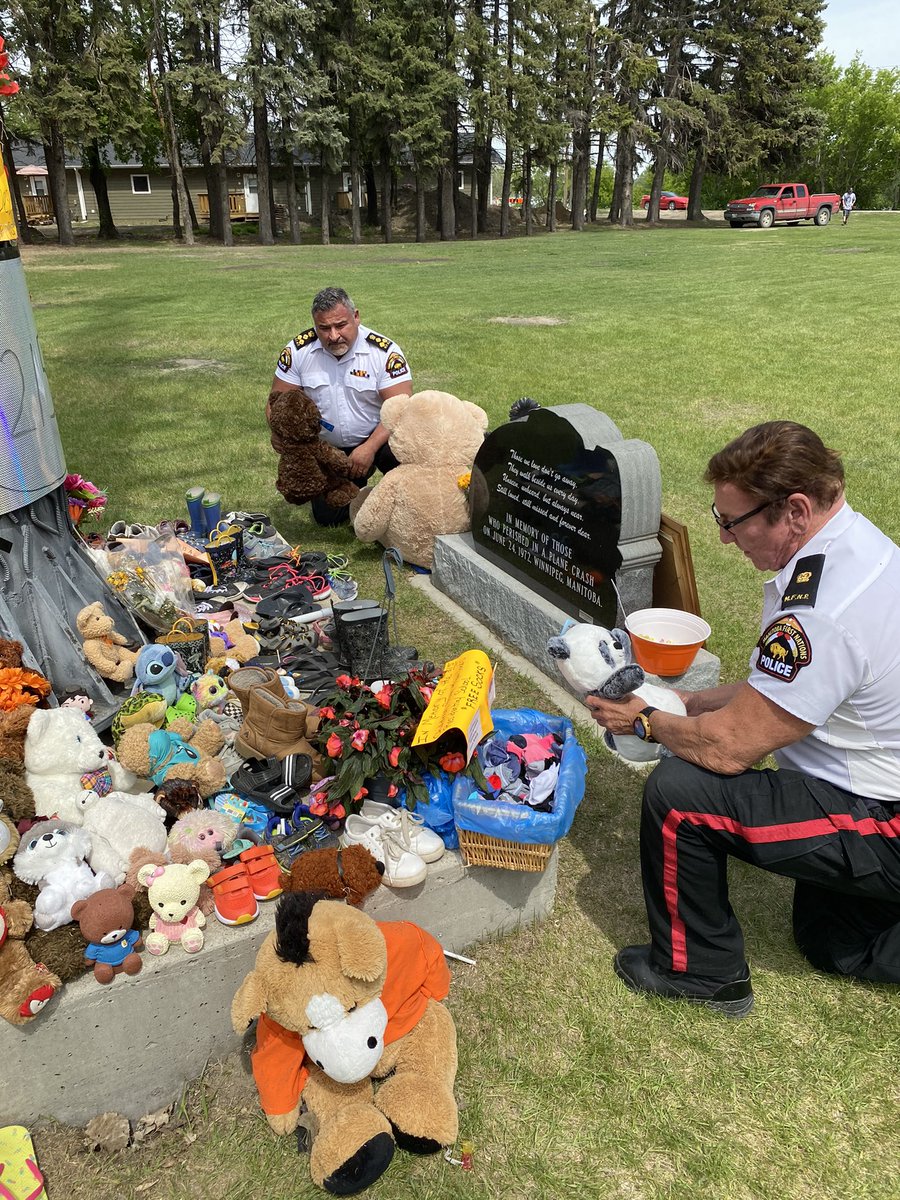MBFNPolice's tweet photo. MFNPS Headquarters A/Chief of Police Rossi & Inspector Scott- pay respects at the Long Plain Residential School- for the Kamloops 215 children- who never made it home. #RIP215 #EveryChildMatters https://t.co/SOeHRSU52X