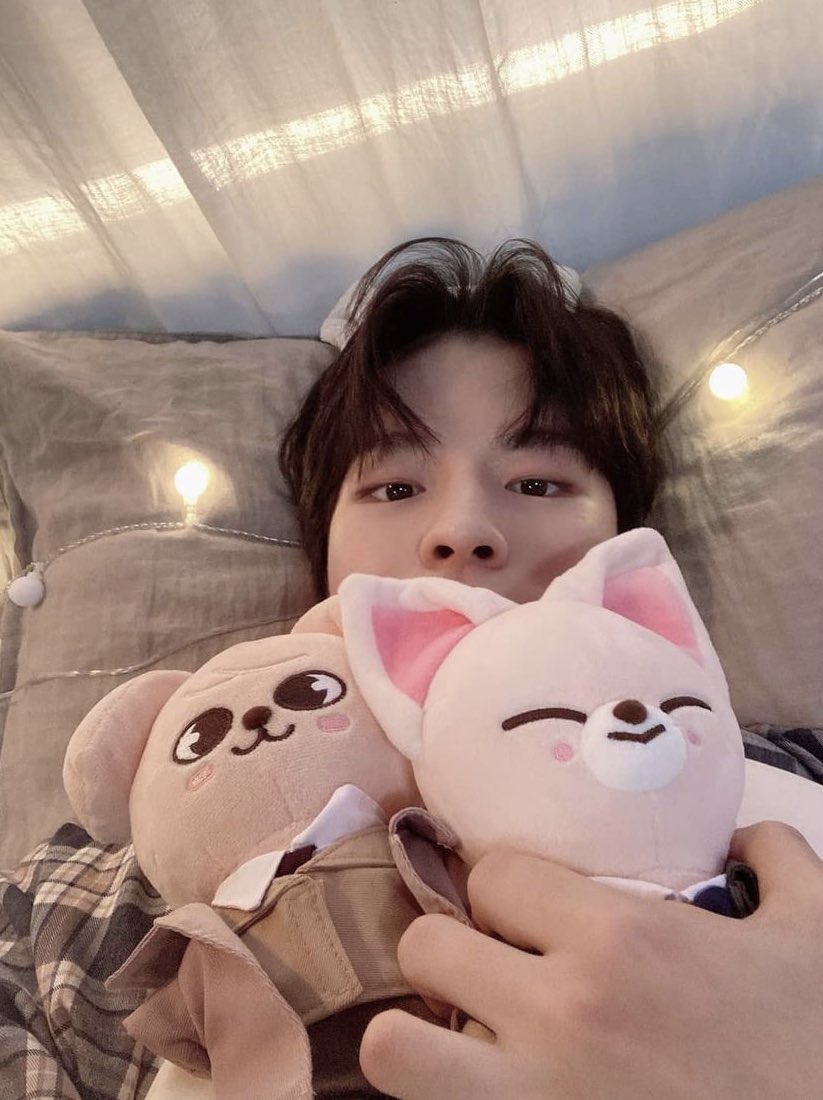 he looks so adorable with the plushies just laying there