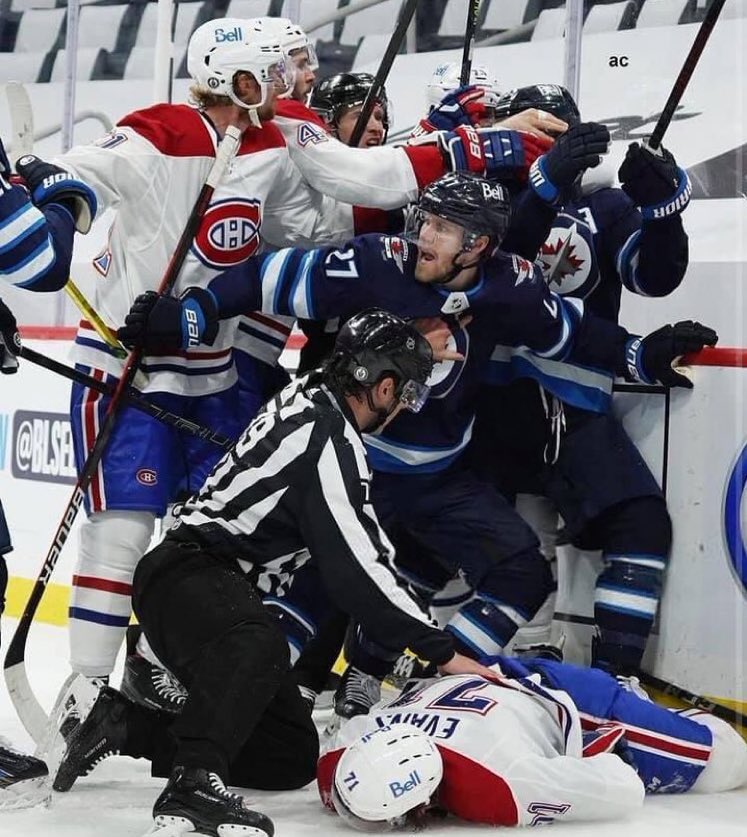Hockey picture of the year, right here! Winnipeg’s Nikolaj Ehlers walls off players scrumming as Montreal’s Jake Evans is tended to. (For the record Evans is back at the hotel recovering after a brutal hit.) When all is said &amp; done, hockey players are part of a brotherhood.