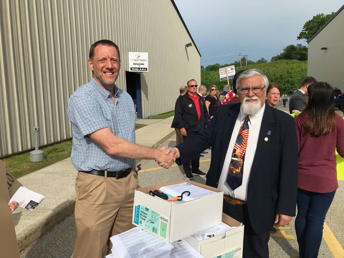 RebuildNH's tweet photo. This morning #ReopenNH chairman Andrew Manuse, treasurer JR Hoell, & 50 activists delivered 5,200 petitions to @NHSpeaker Sherm Packard demanding a ban on "vaccine passports". Say a prayer that @NHHouseofReps will have the courage to protect our rights today! #nhpolitics https://t.co/EI1F1fHTk6