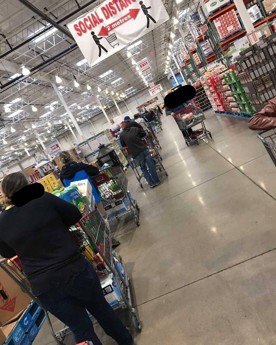 haligonia's tweet photo. No sandals seen in carts however -- From @moneyhugger.ca via @darkvision7 Costco Dartmouth lined up all the way to the back of the store and then some 🤔 https://t.co/vMurY1ehm2