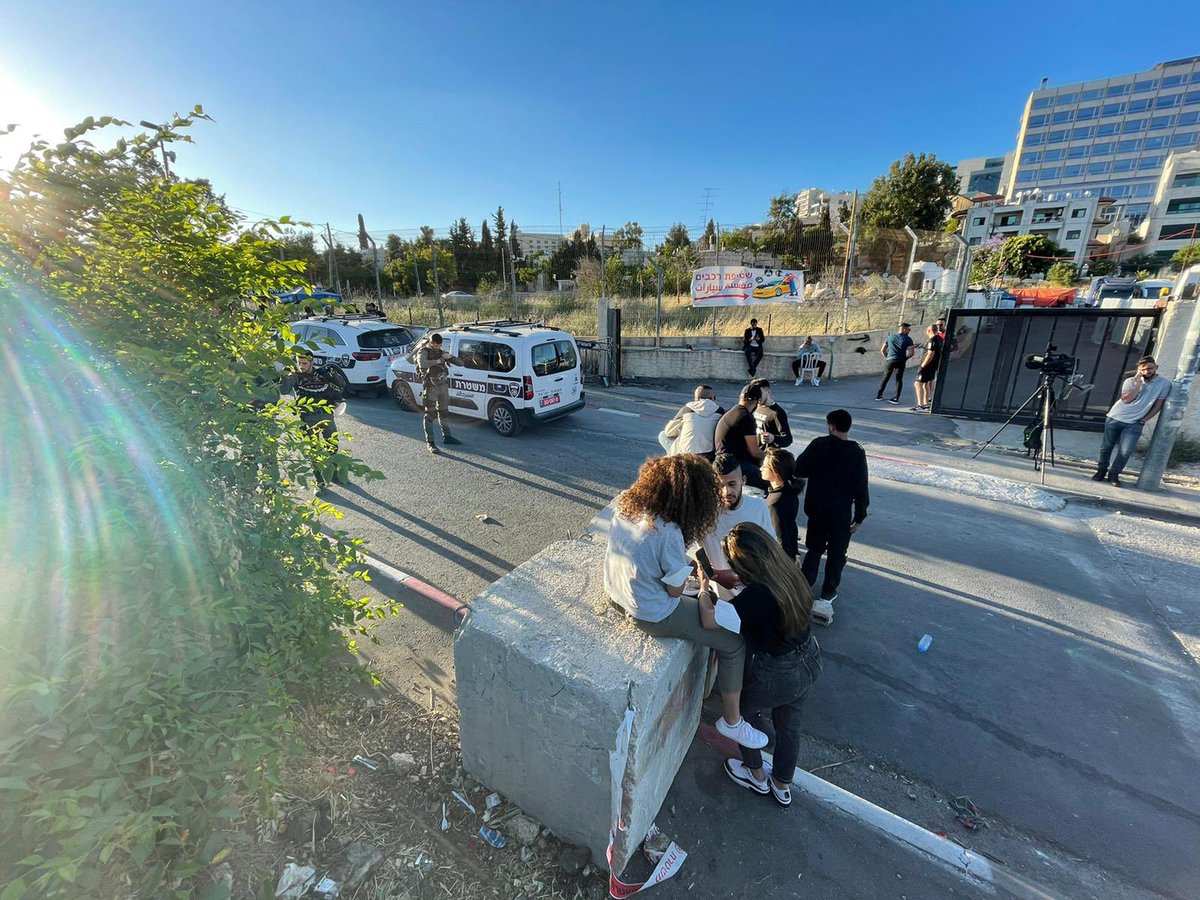 m7mdkurd's tweet photo. The #SheikhJarrah residents were told they wouldn’t be let back in to their homes should they exit past the cement barriers. The protestors outside the barricades were met with skunk water, stun grenades and coated bullets. One woman was injured. Settlers walked in no problem. https://t.co/MePRrEwRTZ