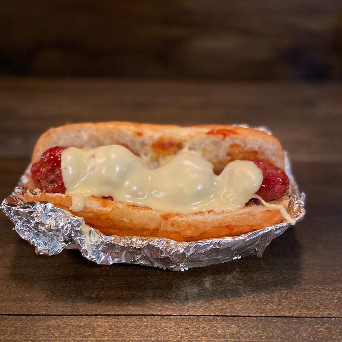 scoutsbbq's tweet photo. This will be our special item for this Sunday. Ground black Angus beef and ground Berkshire pork with our standard bbq rub. Smoked and topped with sweet bbq sauce and our white cheese blend. 199th and Metcalf from 11 till sold out. https://t.co/4usjMow8qW