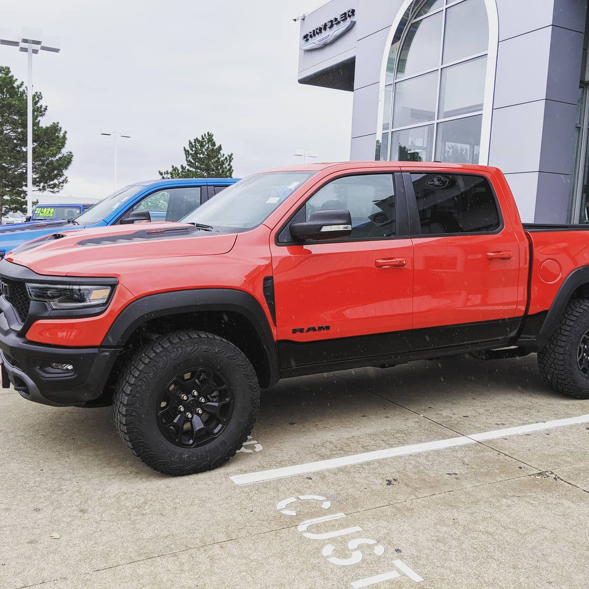 DanDeeryCDJR's tweet photo. Two TRX Rams on the lot 🦖 over 700 horses in these bad boys. Be the intimidator or the intimidated, what do you think of these monstrous trucks? #TRX #Ram #RamTrucks #Hemi https://t.co/FC8oA0BCfG