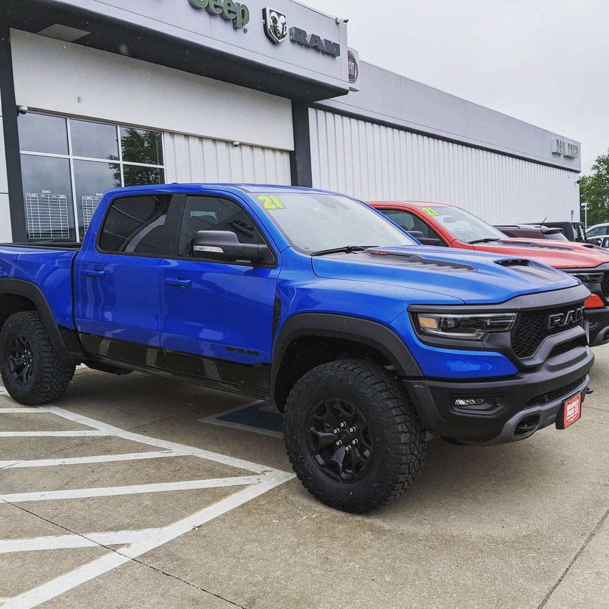 DanDeeryCDJR's tweet photo. Two TRX Rams on the lot 🦖 over 700 horses in these bad boys. Be the intimidator or the intimidated, what do you think of these monstrous trucks? #TRX #Ram #RamTrucks #Hemi https://t.co/FC8oA0BCfG