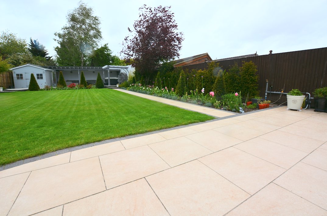 Back to measure up some more work at this @MarshallsReg porcelain patio we previously laid, amazing what a great lawn and planting makes to a patio and garden