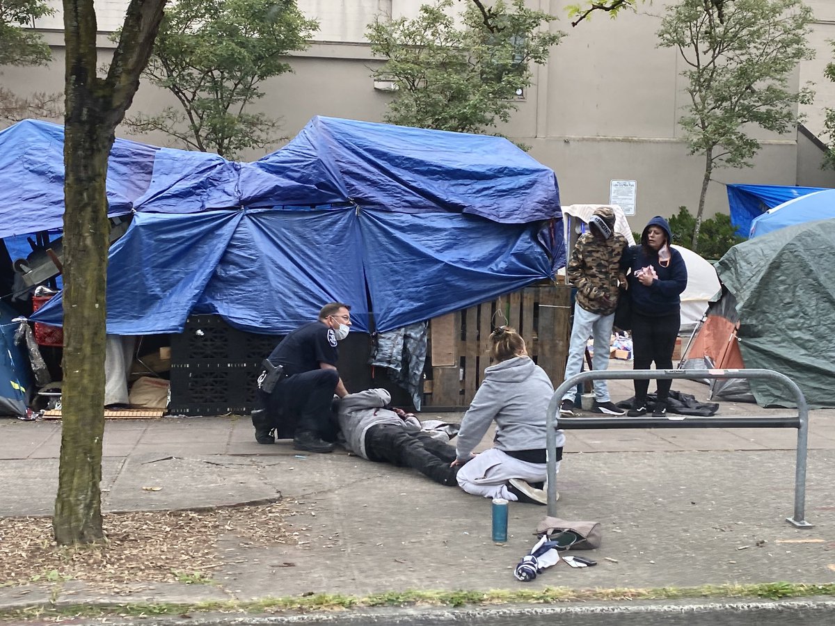 Stay away from 125th and Lake City Way. Police, medics swarming the area after reports of violence there. Photo from scene.