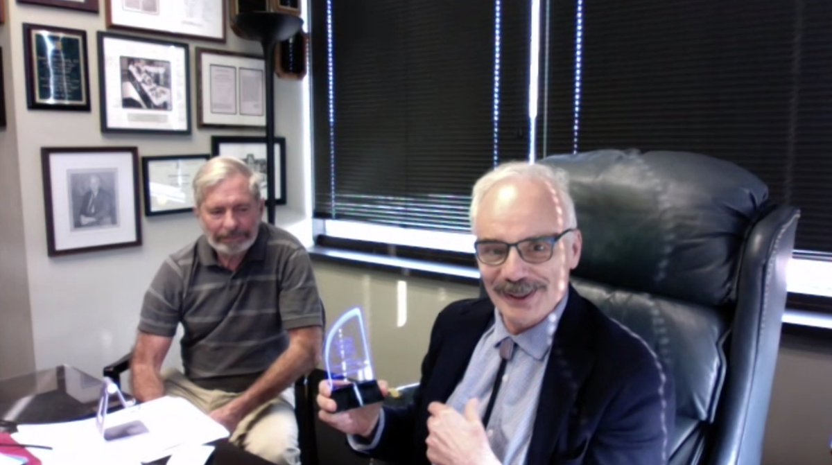 ROCK Society Presidential Award being presented to Ross P. Holmes by Dean Assimos.