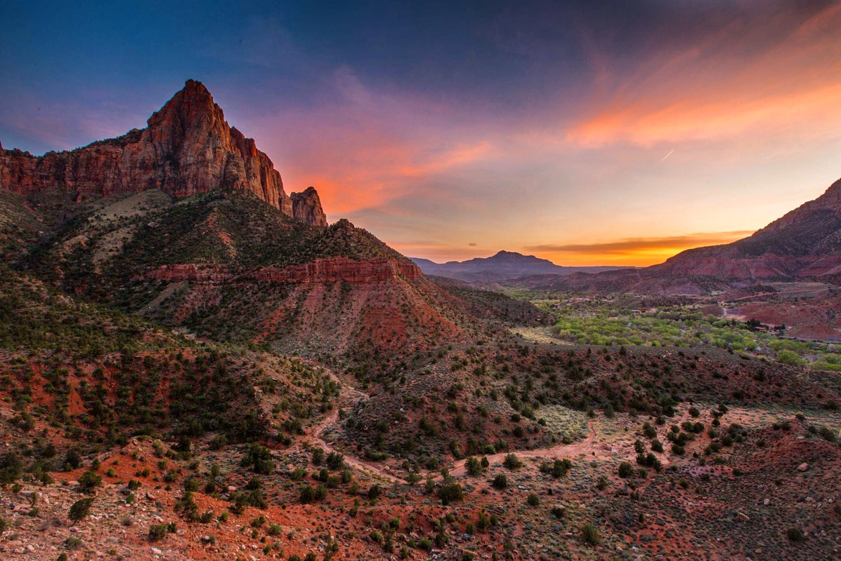 Many <a href="/ZionNPS/">Zion National Park</a> visitors like to stay for sunset and catch some final photos of the massive cliffs glowing vivid neon orange in the late day sun. The craggy walls of cream, pink and red, soar into a brilliant blue sky. 

Pic courtesy of Toni Torena