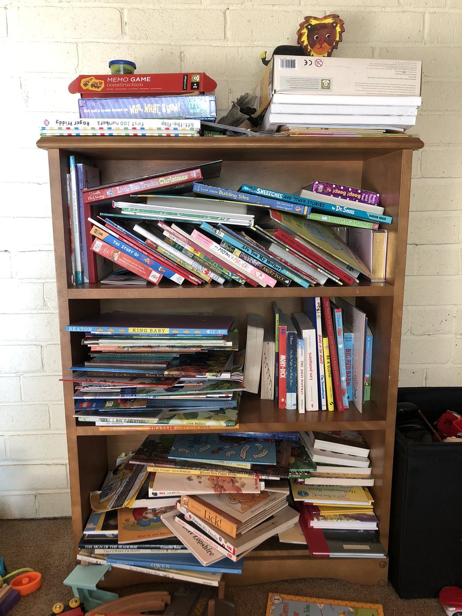 My kids’ bookshelf. Does it hurt my librarian heart? A little. Enough to fix it? Definitely not.