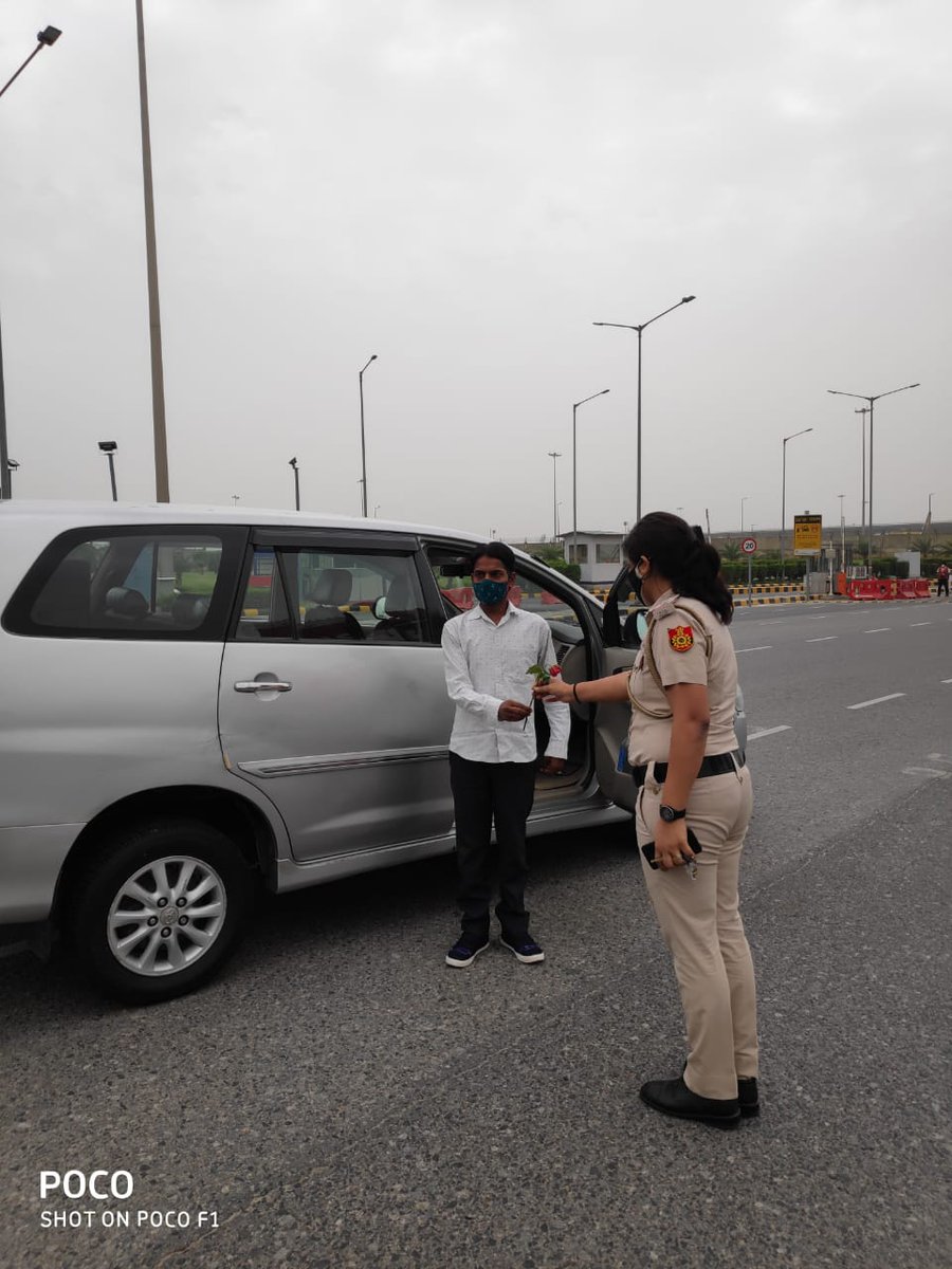 DCP_IGI_Delhi's tweet photo. IGI Airport Police launched special drive to encourage People to #WearAMask and #followSocialDistancing. Masks were distributed among public and those found violating the norms were also gifted a red rose as a non-coercive action and novel gesture by Delhi Police @DelhiPolice https://t.co/Wab5nrVqOD