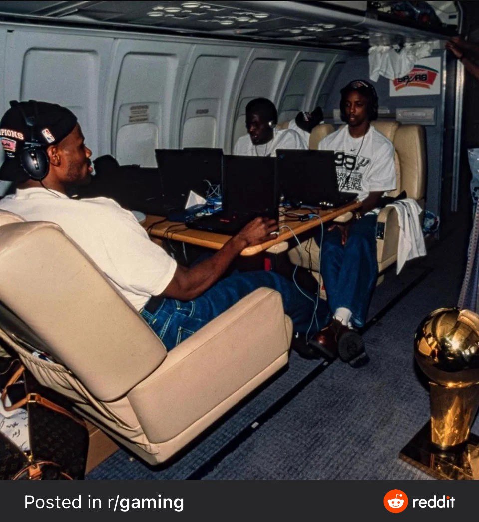 nchan's tweet image. Spurs players setting up an in-flight LAN for StarCraft after winning 1999 NBA season is so great—note championship trophy just chilling on the floor