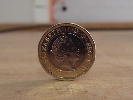The Romans were the first to stamp the image of a living person on a coin.  Julius Caesar was the first in 44 B.C.