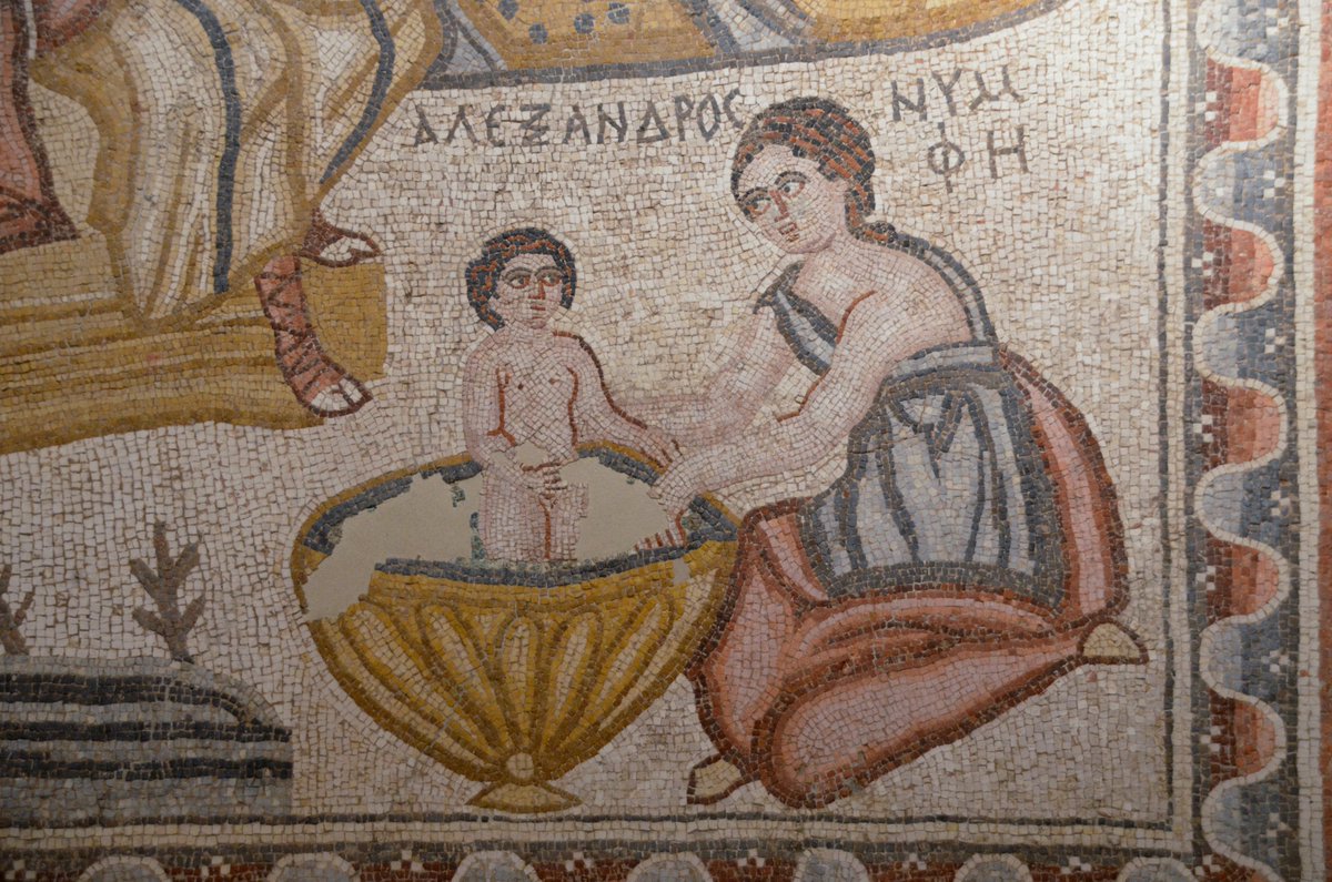 #MosaicMonday The Birth of Alexander the Great Mosaic. 4th century AD, from Baalbek.
The mosaic shows the new-born Alexander the Great ΑΛΕΞΑΝΔΡΟς being bathed in a circular basin by a female figure labelled as ΝΥΜΦΗ (Nymphe), while his mother Olympias ΟΛΥΜΠ… is resting on a bed.