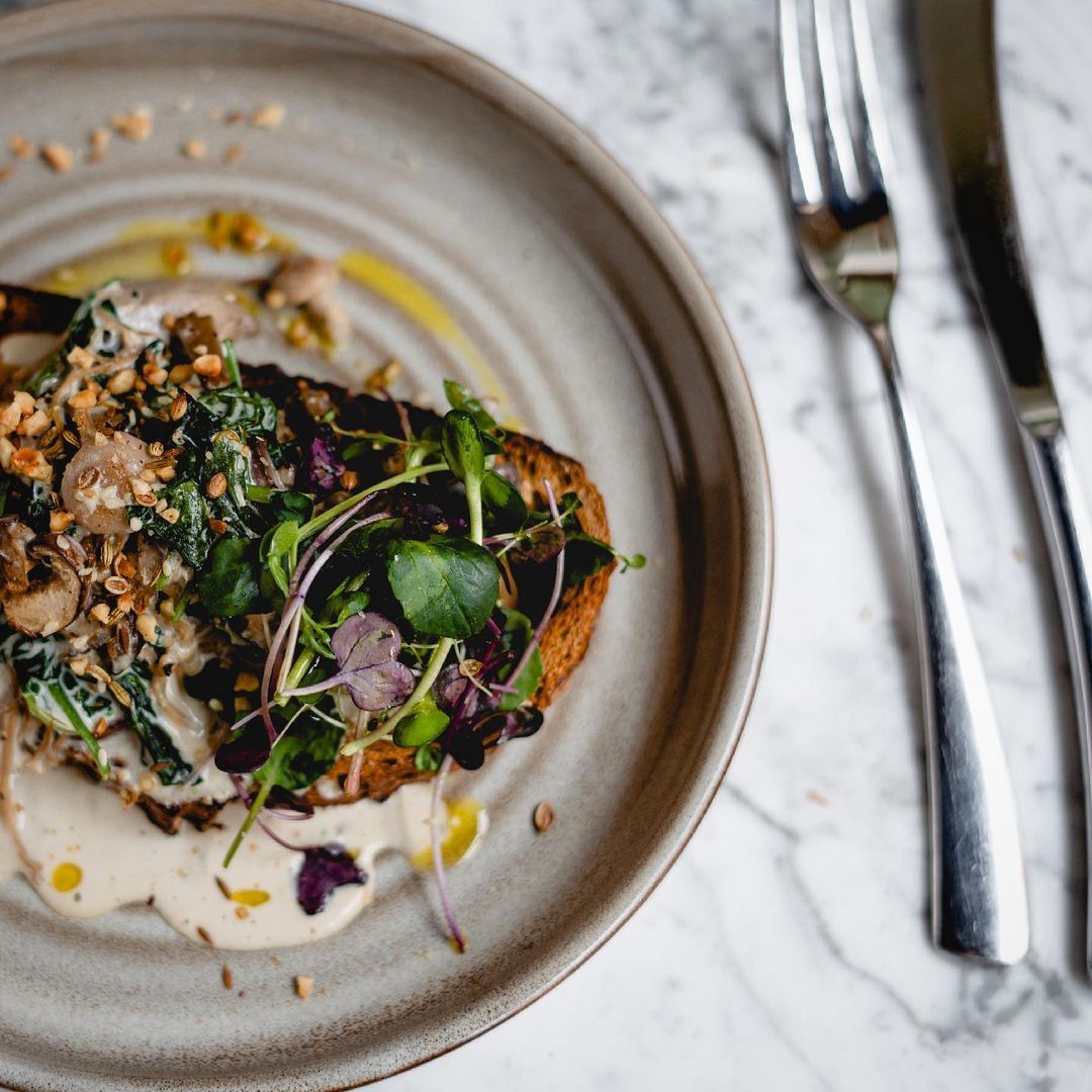 Mushrooms and creamed greens on a slice of freshly baked bread. Topped with Dukkah, it’s a new item on the menu <a href="/mor_bakery/">MOR Bakery & Kitchen</a> and it’s one of the staff favourites.

Oh yeah, it’s #vegan too. Taste the goodness for yourself today!